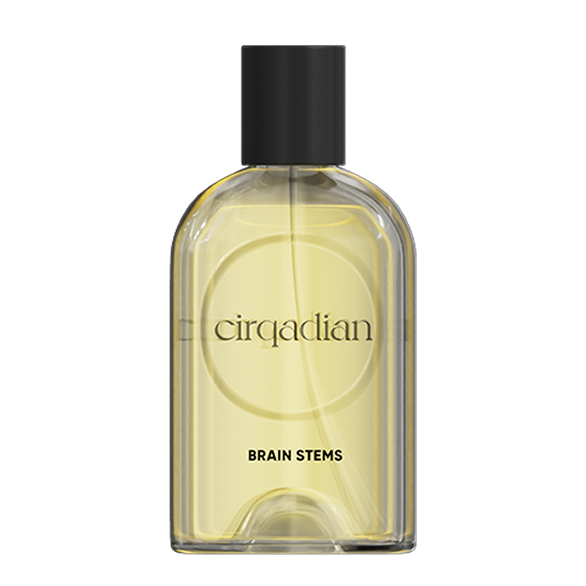 A bottle of Cirqadian Brain Stems fragrance with a clear glass body showing pale yellow liquid, a black cap, and black text on a white background.